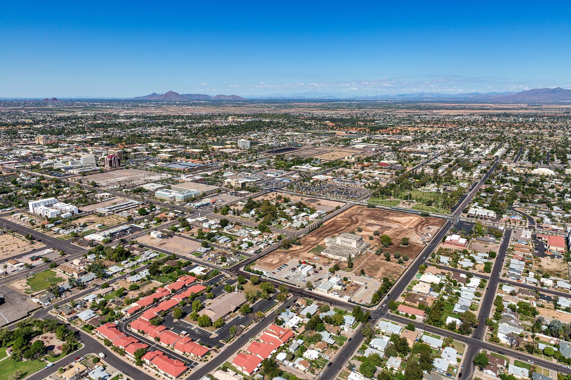 Downtown Mesa, Arizona aerial view looking to the northwest from over third avenue near Mesa Drive showing construction progress, renovation and development in the area